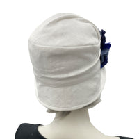 Alice cloche narrow brim hat  hat in antique white linen with blues hydrangea petal brooch rear view